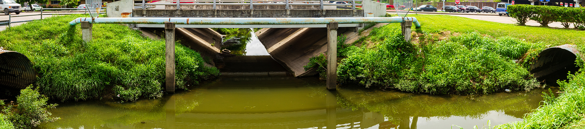 A vegetated stormwater channel in Houston illustrating resilient and sustainable infrastructure